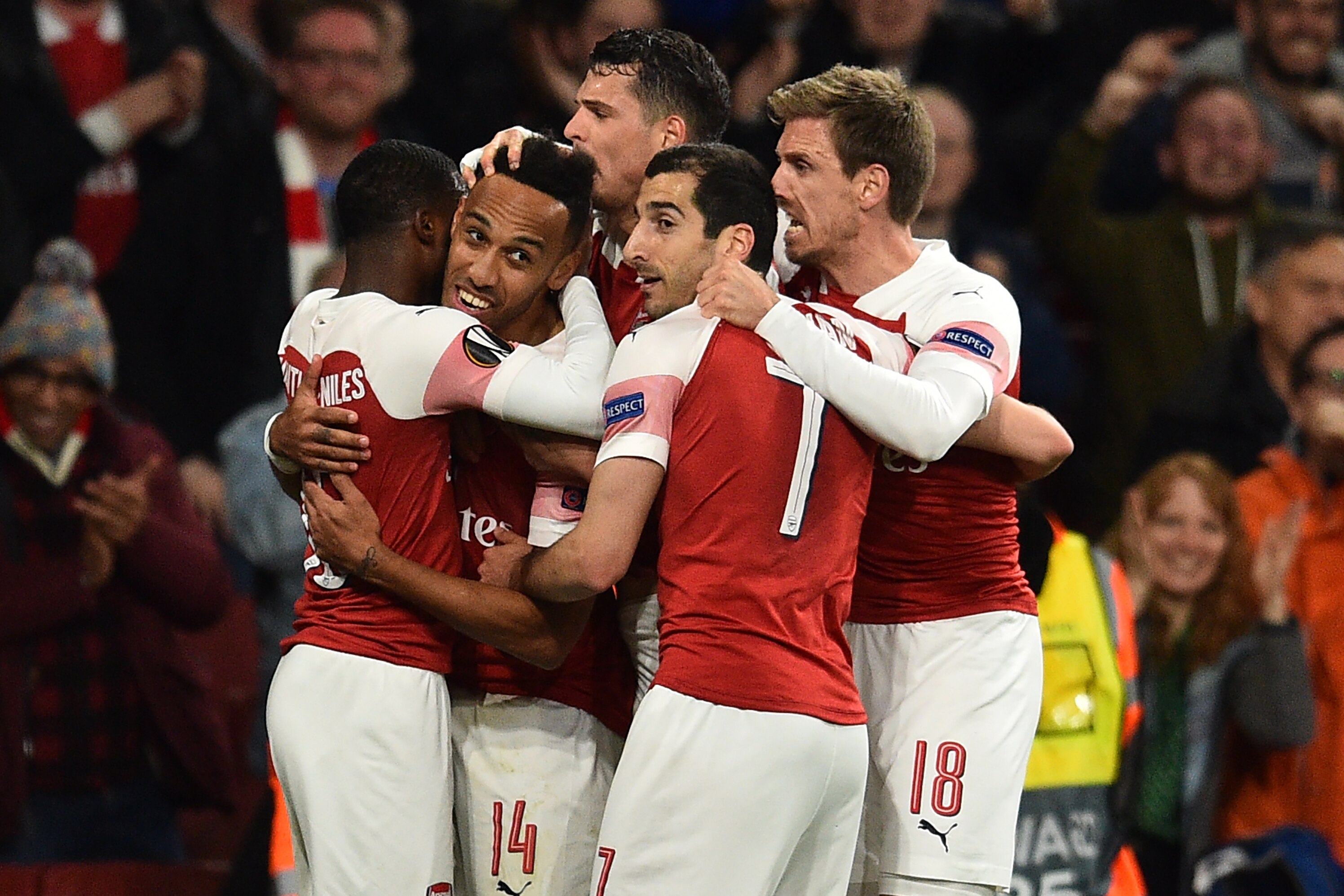 Arsenal's Gabonese striker Pierre-Emerick Aubameyang (2nd L) celebrates with teammates after scoring their third goal during the UEFA Europa League semi final, first leg, football match between Arsenal and Valencia at the Emirates Stadium in London on May 2, 2019. (Photo by Glyn KIRK / AFP) (Photo credit should read GLYN KIRK/AFP/Getty Images)