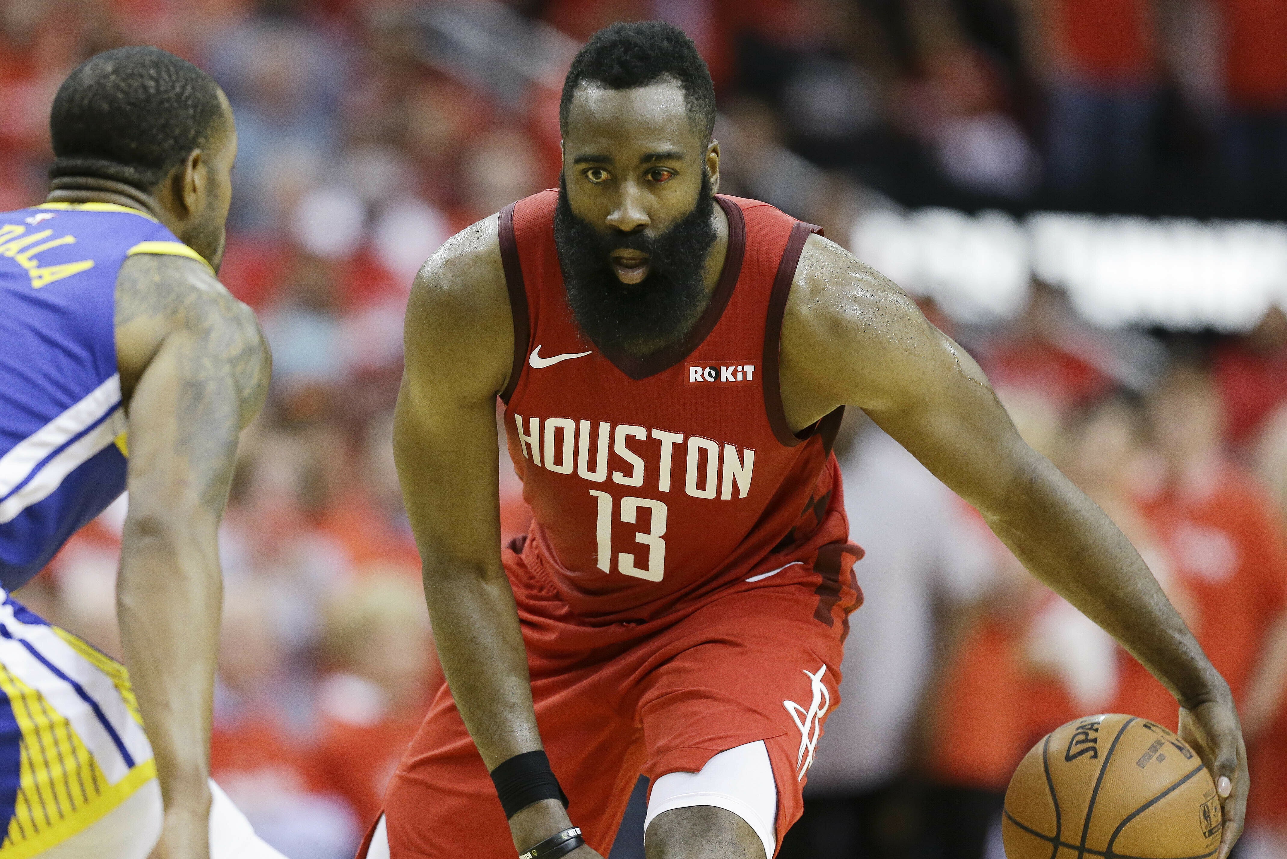 Houston Rockets guard James Harden (13) dribbles as Golden State Warriors guard Andre Iguodala defends during the second half of Game 3 of a second-round NBA basketball playoff series, Saturday, May 4, 2019, in Houston. (AP Photo/Eric Christian Smith)