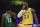 Los Angeles Lakers' LeBron James, right, and Boston Celtics' Kyrie Irving chat with their mouths covered during the first half of an NBA basketball game, Saturday, March 9, 2019, in Los Angeles. (AP Photo/Jae C. Hong)