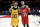 FILE - In this Dec. 29, 2018, file photo, Portland Trail Blazers guard Seth Curry, left, and his brother, Golden State Warriors guard Stephen Curry, exchange jerseys after an NBA basketball game in Portland, Ore. The Curry brothers are returning to their hometown of Charlotte, N.C, for the NBA All-Star weekend. Stephen, a two-time league MVP, will join younger brother Seth in the 3-point shootout on Saturday night at the Spectrum Center and then play in his sixth straight All-Star game on Sunday.  (AP Photo/Steve Dykes, File)