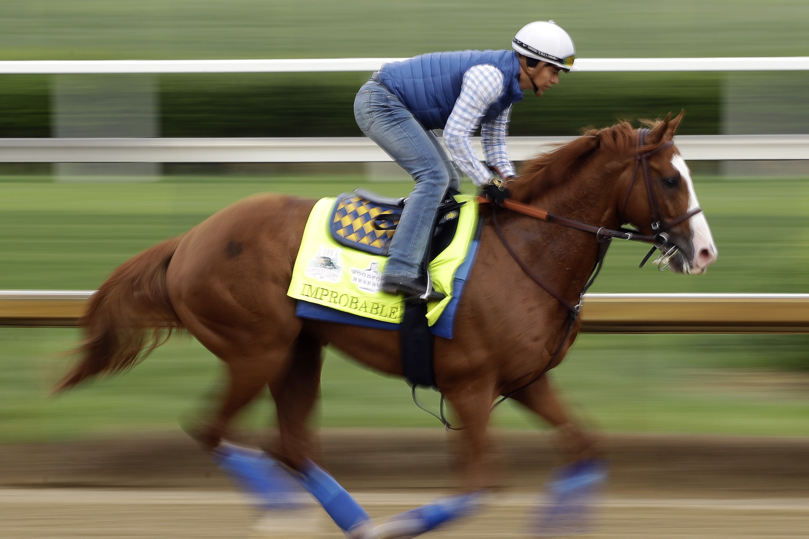 Kentucky Derby entrant Improbable runs during a workout at Churchill Downs Thursday, May 2, 2019, in Louisville, Ky. The 145th running of the Kentucky Derby is scheduled for Saturday, May 4. (AP Photo/Charlie Riedel)