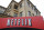 FILE - This Jan. 29, 2010, file photo, shows the company logo and view of Netflix headquarters in Los Gatos, Calif. Investors for years have seemingly adored technology stocks as much as most people love their smartphones. But Wall Street has suddenly soured on Silicon Valley and the rest of tech, triggering a stomach-churning downturn likely to leave millions queasy, should they check the damage to their investment portfolios in Oct. 2018. (AP Photo/Marcio Jose Sanchez, File)