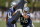 Dallas Cowboys linebacker Tre'von Johnson (58) runs a drill as linebacker Kyle Queiro (41) holds the pad for him during NFL football training camp Friday, July 27, 2018, in Oxnard, Calif. (AP Photo/Gus Ruelas)