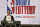 NBA Deputy Commissioner Mark Tatum announces that the Phoenix Suns had won the sixth pick during the NBA basketball draft lottery Tuesday, May 14, 2019, in Chicago. (AP Photo/Nuccio DiNuzzo)