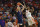 Virginia's Kyle Guy shoots a 3-pointer over Clemson's Shelton Mitchell during the first half of an NCAA college basketball game Saturday, Jan. 12, 2019, in Clemson, S.C. (AP Photo/Richard Shiro)