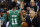 Boston Celtics general manager Danny Ainge tosses the ball, which went out of bounds, to Kyrie Irving during the first quarter of an NBA basketball game against the Los Angeles Lakers in Boston Wednesday, Nov. 8, 2017. (AP Photo/Winslow Townson)