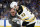 Boston Bruins defenseman Zdeno Chara (33), of Slovakia, is helped off the ice after getting hit in the face with the puck during the second period of Game 4 of the NHL hockey Stanley Cup Final against the St. Louis Blues Monday, June 3, 2019, in St. Louis. (AP Photo/Jeff Roberson)