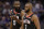 Houston Rockets guard James Harden, left, talks with teammate Chris Paul as they walk off the court during a timeout in the second half of an NBA basketball game against the Sacramento Kings, Tuesday, April 2, 2019, in Sacramento, Calif. The Rockets won 130-105. (AP Photo/Rich Pedroncelli)