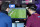 Visitors plays on EA Vancouver video game developer's football simulation video game FIFA 19 at the eSports Bar trade fair in Cannes, southern France on February 13, 2019. - After several years of development under radars, eSports is attracting more and more major brands that are betting on this sector in