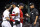 BOSTON, MA - JUNE 11: Manager Alex Cora of the Boston Red Sox argues with first base umpire Vic Carapazza as first base coach Tom Goodwin holds back Andrew Benintendi #16 after Benintendi was ejected during the sixth inning of a game against the Texas Rangers on June 11, 2019 at Fenway Park in Boston, Massachusetts. (Photo by Billie Weiss/Boston Red Sox/Getty Images)