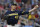 Michigan starting pitcher Tommy Henry (47) throws to first in a pickoff-attempt in the fifth inning of an NCAA College World Series baseball game against Florida State in Omaha, Neb., Monday, June 17, 2019. (AP Photo/Nati Harnik)