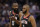 Houston Rockets guard James Harden, left, talks with teammate Chris Paul as they walk off the court during a timeout in the second half of an NBA basketball game against the Sacramento Kings, Tuesday, April 2, 2019, in Sacramento, Calif. The Rockets won 130-105. (AP Photo/Rich Pedroncelli)