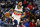FILE - In this March 16, 2019, file photo, New Orleans Pelicans forward Anthony Davis brings the ball up during the first half of the team's NBA basketball game against the Phoenix Suns in New Orleans. Two people familiar with the situation say the Pelicans have agreed to trade Davis to the Los Angeles Lakers for point guard Lonzo Ball, forward Brandon Ingram, shooting guard Josh Hart and three first-round draft choices. The people spoke to The Associated Press on condition of anonymity because the trade cannot become official until the new league year begins July 6. ESPN first reported the trade.(AP Photo/Tyler Kaufman, File)