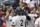 Michigan's Jimmy Kerr, left, is greeted by Jack Blomgren (2) and Jesse Franklin (7) at the dugout after scoring a run against Texas Tech on an RBI double by Blake Nelson in the first inning of an NCAA College World Series baseball game in Omaha, Neb., Friday, June 21, 2019. (AP Photo/Nati Harnik)