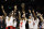 Toronto Raptors center Serge Ibaka, left, guard Kyle Lowry, center, and guard Danny Green, third from right, celebrate with teammates after the Raptors defeated the Golden State Warriors in Game 6 of basketball's NBA Finals in Oakland, Calif., Thursday, June 13, 2019. (AP Photo/Ben Margot)