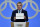 International Olympic Committee (IOC) president Thomas Bach shows the card with the name Milan/Cortina d'Ampezzo as the winning name of the 2026 Winter Olympics during the 134th session of the International Olympic Committee (IOC), in Lausanne on June 24, 2019. (Photo by Fabrice COFFRINI / AFP)        (Photo credit should read FABRICE COFFRINI/AFP/Getty Images)