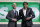 NBA Commissioner Adam Silver poses for photographs with Washington's Matisse Thybulle after the Boston Celtics selected him as the 20th pick overall in the NBA basketball draft Thursday, June 20, 2019, in New York. (AP Photo/Julio Cortez)