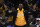 Los Angeles Lakers forward LeBron James celebrates from the bench during the second half of an NBA basketball game against the Los Angeles Clippers Friday, April 5, 2019, in Los Angeles. The Lakers won 122-117. (AP Photo/Mark J. Terrill)