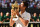 Serbia's Novak Djokovic kisses the winners trophy after beating South Africa's Kevin Anderson 6-2, 6-2, 7-6 in their men's singles final match on the thirteenth day of the 2018 Wimbledon Championships at The All England Lawn Tennis Club in Wimbledon, southwest London, on July 15, 2018. (Photo by Glyn KIRK / AFP) / RESTRICTED TO EDITORIAL USE        (Photo credit should read GLYN KIRK/AFP/Getty Images)