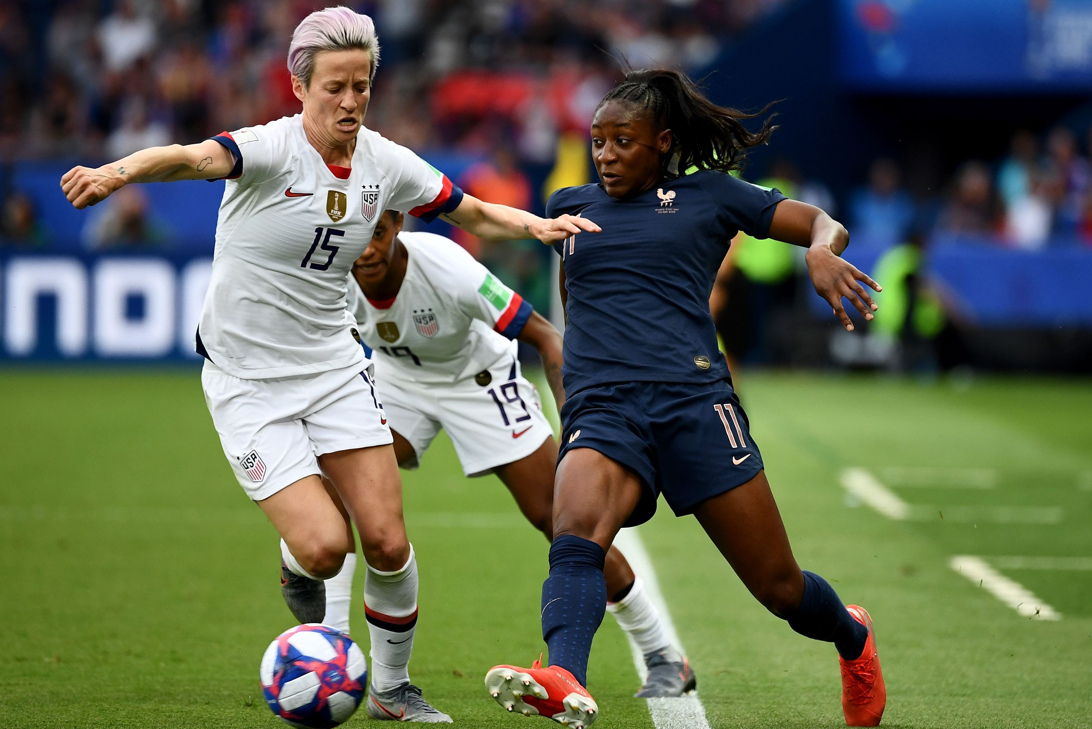 United States' forward Megan Rapinoe (L) fights for the ball with France's forward Kadidiatou Diani during the France 2019 Women's World Cup quarter-final football match between France and United States, on June 28, 2019, at the Parc des Princes stadium in Paris. (Photo by FRANCK FIFE / AFP) (Photo credit should read FRANCK FIFE/AFP/Getty Images)