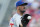 Chicago Cubs starting pitcher Cole Hamels receives the ball in the first inning of a baseball game against the Cincinnati Reds, Friday, June 28, 2019, in Cincinnati. (AP Photo/John Minchillo)
