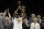 Toronto Raptors forward Kawhi Leonard, center left, celebrates after the Raptors defeated the Golden State Warriors in Game 6 of basketball's NBA Finals in Oakland, Calif., Thursday, June 13, 2019. (AP Photo/Ben Margot)