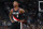 Portland Trail Blazers guard Damian Lillard looks on during a timeout against the Denver Nuggets in the first half of Game 5 of an NBA basketball second-round playoff series, Tuesday, May 7, 2019, in Denver. (AP Photo/David Zalubowski)