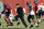 Atlanta Falcons head coach Dan Quinn runs with his players during their NFL training camp football practice Thursday, July 25, 2019, in Flowery Branch, Ga.(AP Photo/John Bazemore)