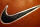 A Nike Swoosh is seen on a basketball at Niketown in Portland, Ore., Tuesday, March 21, 2006.  Nike Inc. is expected to release third-quarter earnings after the close of trading. (AP Photo/Rick Bowmer)