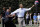 FILE - In this April 9, 2012, file photo, President Barack Obama plays basketball with former NBA basketball player Bruce Bowen during the annual White House Easter Egg Roll at the White House in Washington. Bidding was drawing to a close Friday, Aug. 16, 2019, for a basketball No. 23 Punahou School jersey believed to have been worn by President Barack Obama. Obama the wore that number during the 1978-79 school year in Honolulu. (AP Photo/Carolyn Kaster, File)