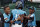 Curacao's Curley Martha, center, is greeted by Shendrion Martinus, left, and Fran-J Confesor after hitting a solo home run off South Korea's Jinwon Na (13) during the third inning of a baseball game at the Little League World Series in South Williamsport, Pa., Thursday, Aug. 22, 2019. Curacao won 5-3. (AP Photo/Gene J. Puskar)
