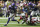 Minnesota Vikings running back Dalvin Cook (33) runs from Arizona Cardinals defenders Tramaine Brock (20) and D.J. Swearinger (36) during an 85-yard touchdown run in the first half of an NFL preseason football game, Saturday, Aug. 24, 2019, in Minneapolis. (AP Photo/Jim Mone)