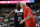 United States' Kemba Walker, left, talks to  coach Gregg Popovich during the first half of the team's exhibition basketball game against Spain on Friday, Aug. 16, 2019, in Anaheim, Calif. (AP Photo/Marcio Jose Sanchez)