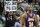 Los Angeles Lakers guard Kobe Bryant (24) walks up court as a fan holds a sign comparing Bryant unfavorably with Michael Jordan, during the fourth quarter in Game 5 of the NBA basketball finals against the Boston Celtics on Sunday, June 13, 2010, in Boston. The Celtics won 92-86 and lead the series 3-2. (AP Photo/Michael Dwyer)