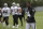 Oakland Raiders' Antonio Brown, right, walks on the field during NFL football practice in Alameda, Calif., Tuesday, Aug. 20, 2019. (AP Photo/Jeff Chiu)