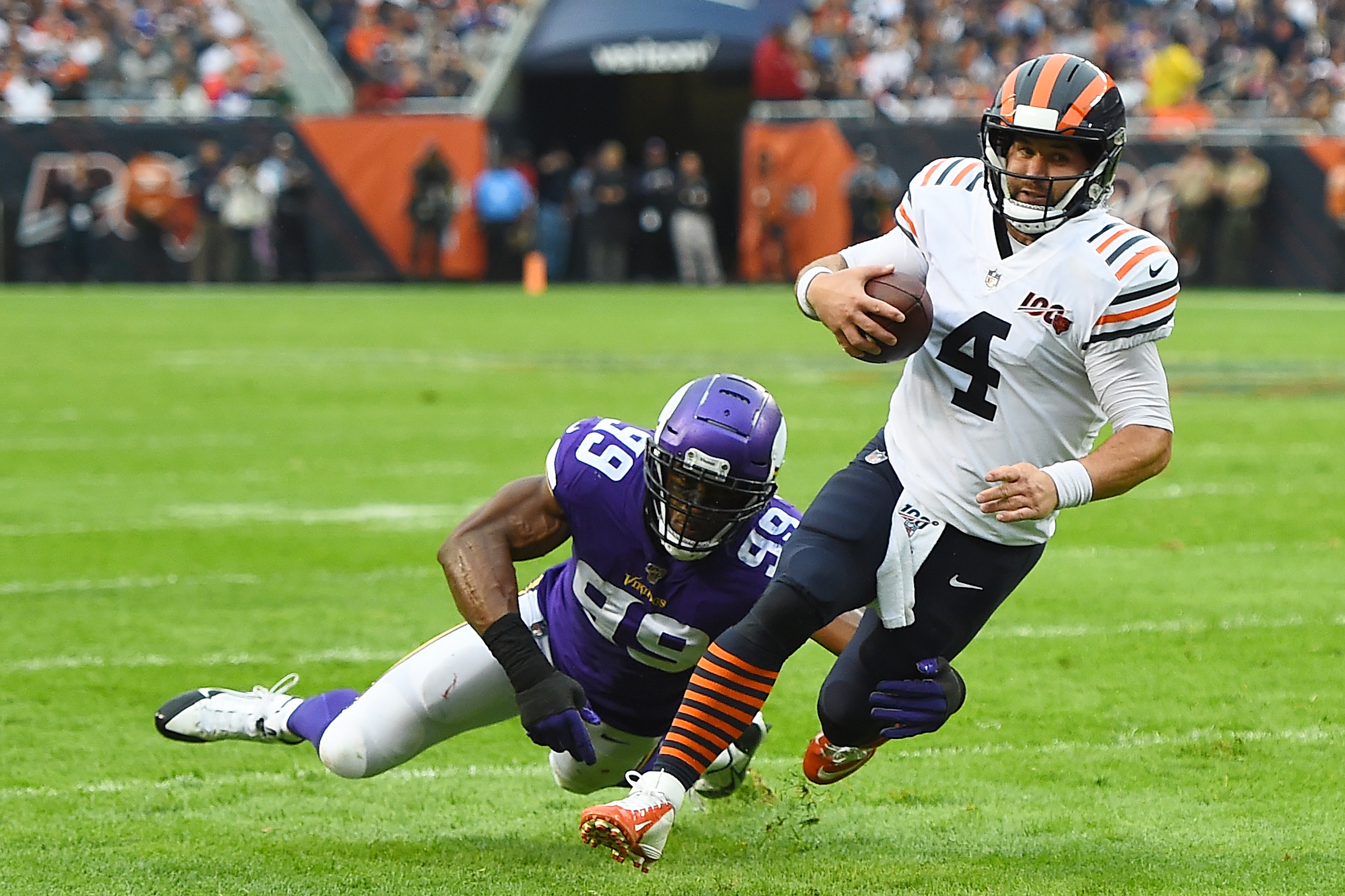 CHICAGO, ILLINOIS - SEPTEMBER 29: Chase Daniel #4 of the Chicago Bears is brought down by Danielle Hunter #99 of the Minnesota Vikings during the first half at Soldier Field on September 29, 2019 in Chicago, Illinois. (Photo by Stacy Revere/Getty Images)