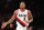 PORTLAND, OREGON - OCTOBER 23: CJ McCollum #3 of the Portland Trail Blazers high fives teammates in the fourth quarter against the Denver Nuggets during their season opener at Moda Center on October 23, 2019 in Portland, Oregon. NOTE TO USER: User expressly acknowledges and agrees that, by downloading and or using this photograph, User is consenting to the terms and conditions of the Getty Images License Agreement (Photo by Abbie Parr/Getty Images)