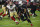 Arizona Cardinals quarterback Kyler Murray (1) scrambles as San Francisco 49ers defensive end Ronald Blair (98) pursues during the second half of an NFL football game, Thursday, Oct. 31, 2019, in Glendale, Ariz. (AP Photo/Ross D. Franklin)