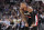 Portland Trail Blazers' Damian Lillard pauses on the court during the second half of an NBA basketball game against the San Antonio Spurs, Saturday, Nov. 16, 2019, in San Antonio. Portland won 121-116. (AP Photo/Darren Abate)