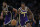 Los Angeles Lakers guard Kentavious Caldwell-Pope (1) takes the ball up court with forward Anthony Davis (3) against the Utah Jazz during the second half of an NBA basketball game in Los Angeles, Friday, Oct. 25, 2019. (AP Photo/Alex Gallardo)