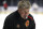 Calgary Flames head coach Bill Peters watches his team practice in Beijing, China, Monday, Sept. 17, 2018. The Flames faced off against the Boston Bruins in southern Chinese city of Shenzhen on Saturday and will play the Bruins again in Beijing on Wednesday in the 2018 NHL China Games. (AP Photo/Mark Schiefelbein)