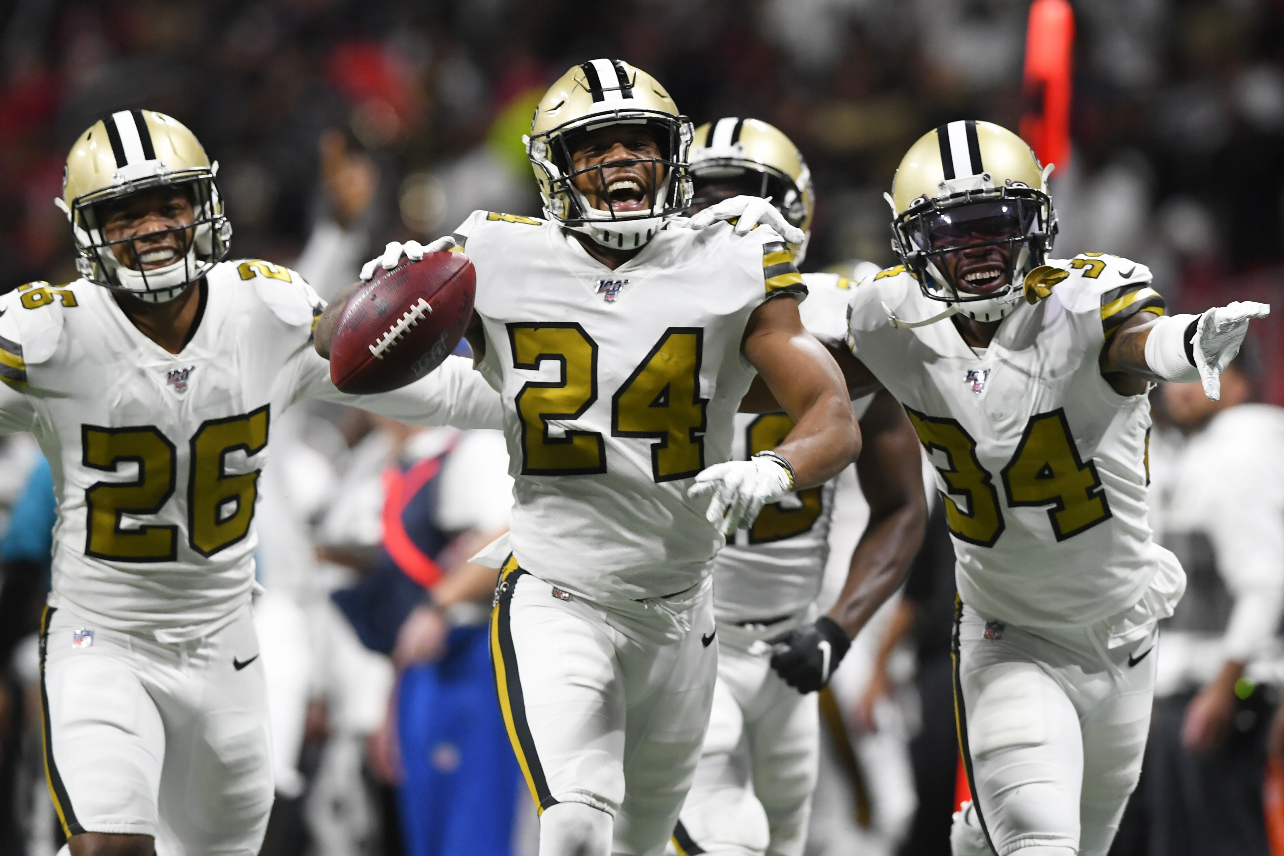 New Orleans Saints strong safety Vonn Bell (24) celebrates with teammates after his interception against the Atlanta Falcons during the second half of an NFL football game, Thursday, Nov. 28, 2019, in Atlanta. (AP Photo/John Amis)