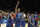 Japeth Aguilar of the Philippines, center, waves with teammates after winning the Group B Basketball World Cup match against Senegal in Seville, Spain, Thursday, Sept. 4, 2014. The 2014 Basketball World Cup competition will take place in various cities in Spain from Aug. 30 through to Sept. 14. (AP Photo/Miguel Angel Morenatti)