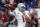 Ohio State quarterback Justin Fields warms up for the team's NCAA college football game against Wisconsin for the Big Ten championship Saturday, Dec. 7, 2019, in Indianapolis. (AP Photo/Michael Conroy)