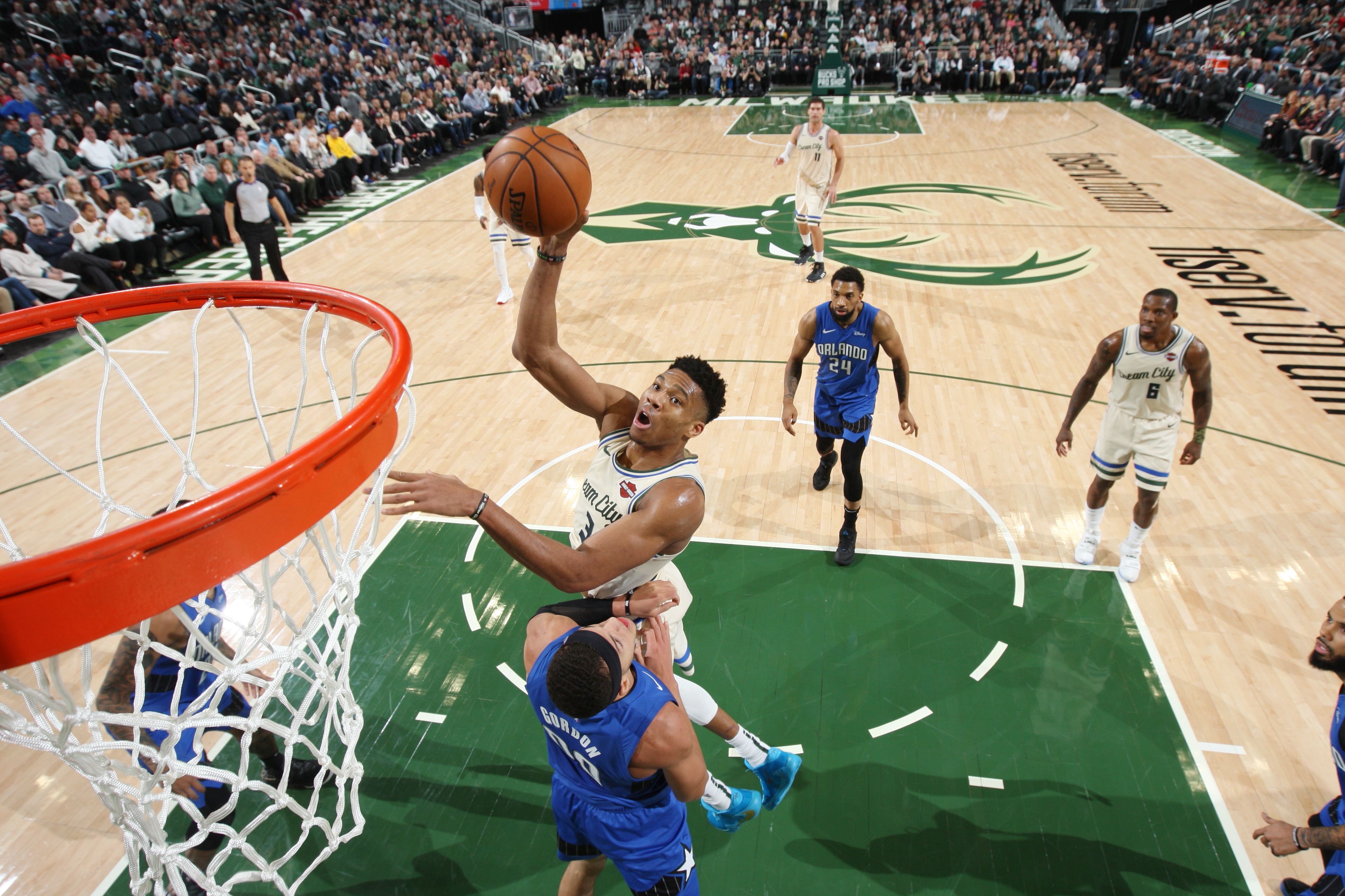 MILWAUKEE, WI - DECEMBER 9: Giannis Antetokounmpo #34 of the Milwaukee Bucks shoots the ball against the Orlando Magic on December 9, 2019 at the Fiserv Forum Center in Milwaukee, Wisconsin. NOTE TO USER: User expressly acknowledges and agrees that, by downloading and or using this Photograph, user is consenting to the terms and conditions of the Getty Images License Agreement. Mandatory Copyright Notice: Copyright 2019 NBAE (Photo by Gary Dineen/NBAE via Getty Images).