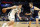 Milwaukee Bucks' Ersan Ilyasova, left, of Turkey, drives as Minnesota Timberwolves' Jake Layman defends in the first half of an NBA basketball game Monday, Nov 4, 2019, in Minneapolis. (AP Photo/Jim Mone)