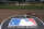 The Major League Baseball logo serves as the visitor's on deck circle before a baseball game between the Chicago White Sox and the Cleveland Indians Wednesday, April 24, 2013, in Chicago. (AP Photo/Charles Rex Arbogast)
