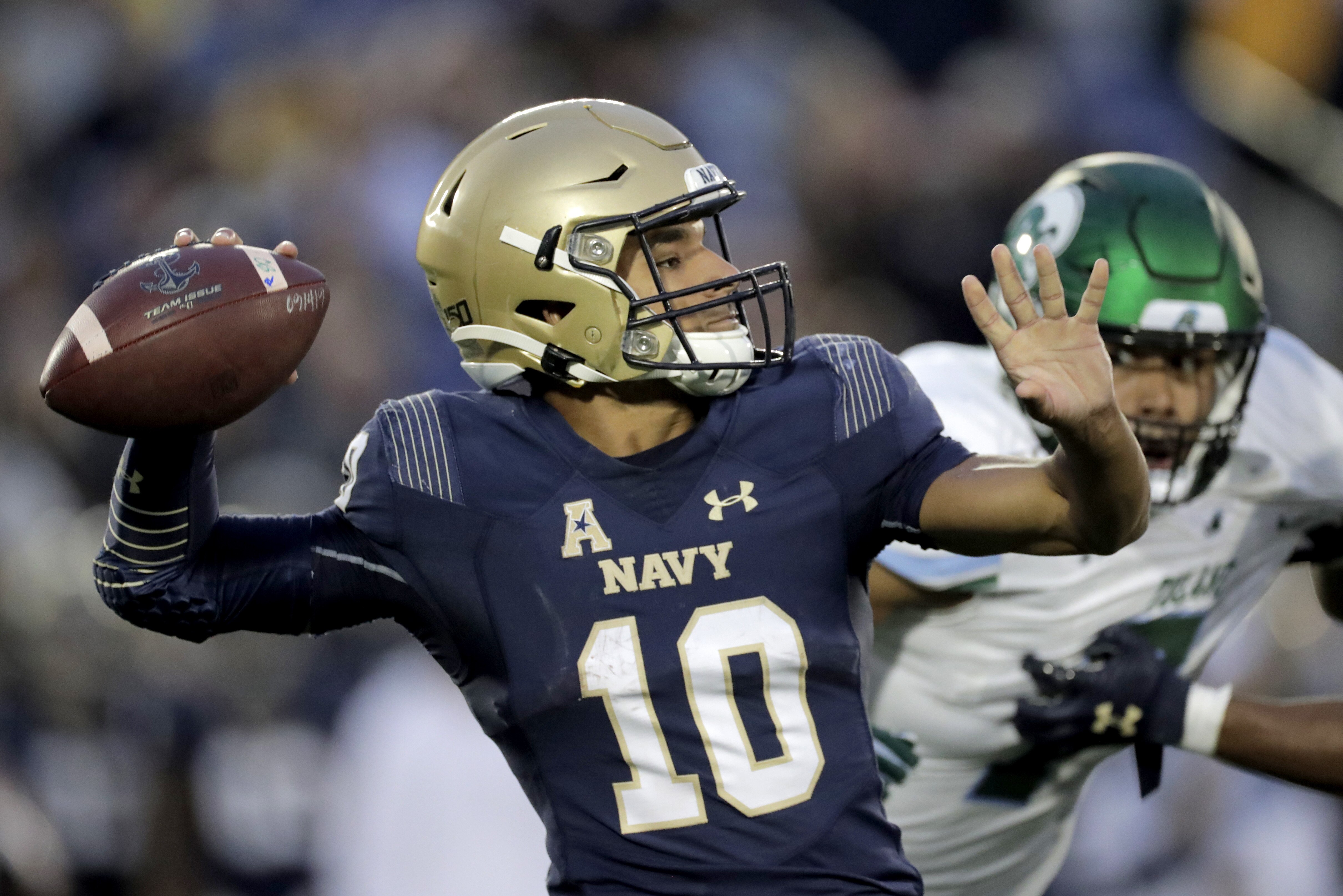Navy quarterback Malcolm Perry throws a pass against Tulane during the second half of an NCAA college football game, Saturday, Oct. 26, 2019, in Annapolis. Navy won 41-38. (AP Photo/Julio Cortez)