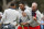 MELBOURNE, AUSTRALIA - DECEMBER 14: Tony Finau of the United States team and Matt Kuchar of the United States team react on the 18th green after halving their match with Byeong-Hun An of South Korea and the International team and Adam Scott of Australia and the International team during Saturday four-ball matches on day three of the 2019 Presidents Cup at Royal Melbourne Golf Course on December 14, 2019 in Melbourne, Australia. (Photo by Darrian Traynor/Getty Images)