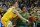 Oregon guard Will Richardson (0) drives on Michigan guard Franz Wagner (21) in the first half of an NCAA college basketball game in Ann Arbor, Mich., Saturday, Dec. 14, 2019. (AP Photo/Paul Sancya)